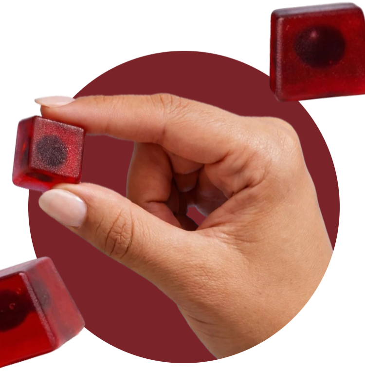 Hand holding a Renew NAD+ gummy